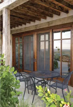  ??  ?? LEFT Choose French doors with real divided lights, or choose real wood applied over a single glass light, as seen in these from Silverado Custom Wood Doors. BELOW Pairs of bifold doors from Marvin feature glazing details that coordinate with the...