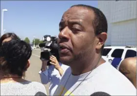  ?? FRANK ELTMAN— THE ASSOCIATED PRESS ?? In this April 28 photo, Robert Mickens speaks with reporters outside the U.S. District Courthouse in Central Islip, N.Y. His daughter, Nisa Mickens, was one of two teenagers who were beaten and slashed to death in September 2016 in a suspected MS-13...