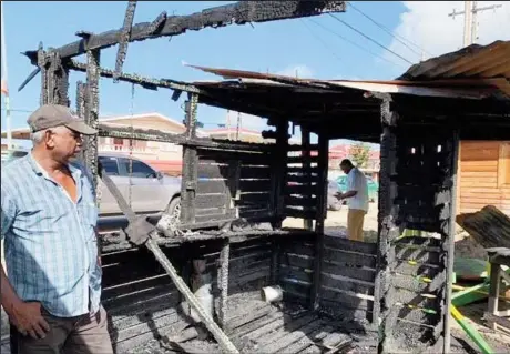  ??  ?? The charred remains of the torched butcher shop (Department of Public Informatio­n photo)