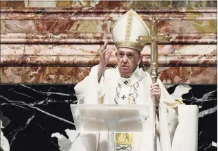  ?? Filippo Monteforte / Associated Press ?? Pope Francis blesses attendees after celebratin­g Easter Mass at St. Peter’s Basilica at The Vatican on Sunday.