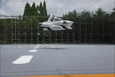  ?? ©SKYDRIVE — CARTIVATOR 2020 VIA AP ?? A test flight of a manned ‘”flying car” at Toyota Test Field in Toyota, central Japan. Japan’s SkyDrive Inc., among the myriads of “flying car” projects around the world, has carried out a successful though modest test flight with one person aboard.