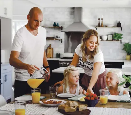  ?? JENNIFER SKOG ?? Livermore cookbook author Michelle Smith and her Whole Smiths family — Brad, Teagan and Camryn — enjoy breakfast at home.