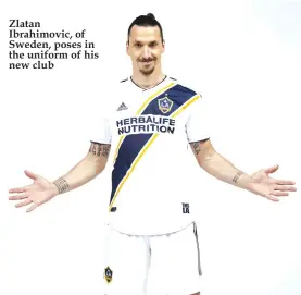  ??  ?? Zlatan Ibrahimovi­c, of Sweden, poses in the uniform of his new club