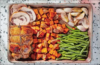 ?? TOM MCCORKLE/THE WASHINGTON POST ?? Sheet Pan Turkey Breast Roulade With Sweet Potatoes, Green Beans and Shallots