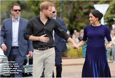  ??  ?? Protection officers were never far from Meghan and Harry when they were working royals