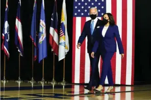  ??  ?? Democratic presidenti­al candidate former Vice President Joe Biden and his running mate Sen. Kamala Harris, D-calif., arrive to speak at a news conference at Alexis Dupont High School in Wilmington, Del., Wednesday, Aug., 12, 2020. (Photo by Carolyn Kaster, AP)