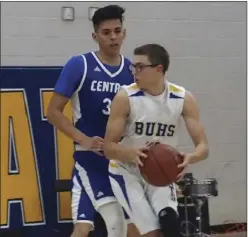  ??  ?? Brawley Union High’s Austin Brewer attempts to make a drive to the basket as Central Union High’s Diego Baez defends. Both players picked up All-IVL second team honors this season. KARINA LOPEZ FILE PHOTO