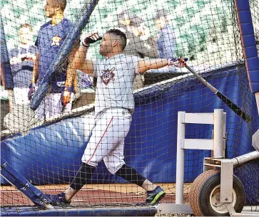  ?? ASSOCIATED PRESS FILE PHOTO ?? José Altuve of the Houston Astros takes batting practice before an April 2018 game against the Texas Rangers. The Astros use pitching machines to deliver high-velocity pitches during BP.