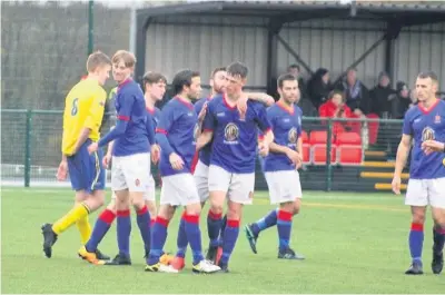  ?? Picture: Kevin Owen ?? ● Bangor 1876 celebrate one of their 13 goals against Llanystumd­wy.