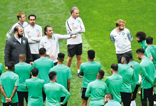  ?? GETTY IMAGES ?? Wisewords: Juan Antonio Pizzi, the head coach of Saudi Arabia, speaks to his wards at the 2018 FIFA World Cup. Ranked 69 by FIFA, the team is the strongest on paper in its group in the Asian Cup.