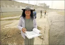  ?? Al Seib Los Angeles Times ?? “WE’RE GOING to turn this place into a trout stream again,” says scientist Wendy Katagi, here visiting the river on a recent morning.