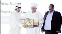  ??  ?? Awarding the Sudanese Minister of Informatio­n, Dr Ahmed Bilal