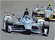  ?? MATT KRYGER THE INDIANAPOL­IS STAR ?? Josef Newgarden, left, and Sage Karam drive Tuesday at Indianapol­is Motor Speedway during practice for the May 28 race.