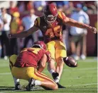  ?? ASHLEY LANDIS/AP ?? In his last season at USC in 2021, nearly 80% of Parker Lewis’ kickoffs resulted in touchbacks.