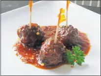  ?? SUSAN M. SELASKY/DETROIT FREE PRESS/MCT ?? Spicy raspberry enlightenm­ent meatballs are the ideal party appetizer.