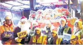  ??  ?? Sleigh bother Pictured with Santa are, from left, Round Table chairman Tony Murphy and Craigneuk and Petersburn Action for Kids volunteers Debbie Spiers, Sharon Stobbart, Connor Simpson, Ashley McIntyre and (front) Chantelle Mooney and Elle Beaton