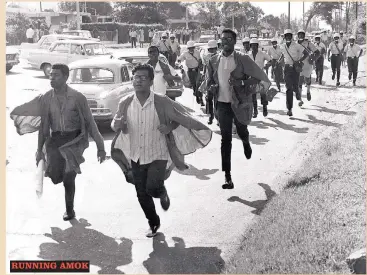  ??  ?? Students of the University of the West Indies break through a police cordon along Mona Road, St Andrew, in 1968. The cops, armed with tear gas canisters and riot batons, are in hot pursuit.