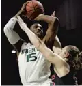  ?? WILFREDO LEE/AP
Story, 2C ?? Miami’s Ebuka Izundu goes up for a shot against North Carolina State’s Wyatt Walker on Thursday. UM dropped its ACC opener 87-82.