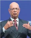  ??  ?? FABRICE COFFRINI, AFP/GETTY IMAGES Founder and executive chairman of the World Economic Forum, Klaus Schwab, addresses the assembly on the eve of the confab in Davos.