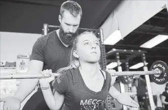  ?? ALEX HECHT NYT ?? Etta Nichols trains with her coach, Eric Cafferty. Powerlifti­ng is more popular than ever among the grade-school set, and even some much younger children.