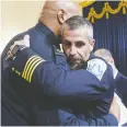  ?? ANDREW HARNIK / THE ASSOCIATED PRESS/BLOOMBERG ?? Officer Michael Fanone,
right, and Harry Dunn, private first class with the U.S. Capitol Police, following Tuesday’s hearing.