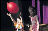  ??  ?? Dylan Hanson, two and Scarlett Hanson, five, with a balloon