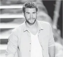  ?? KEVIN WINTER/GETTY IMAGES ?? Melbourne native Liam Hemsworth, seen here onstage at the Teen Choice Awards, plays a corporate spy in the thriller Paranoia.