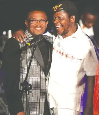  ??  ?? ZIMA chairman Joseph Nyadzayo (left) with Cde Chinx at the 2014 awards