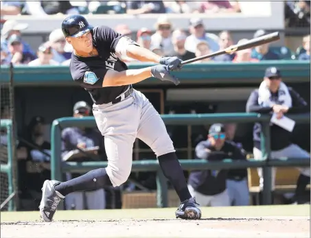  ?? John Raoux / Associated Press ?? New York Yankees’ Aaron Judge bats against the Detroit Tigers in the third inning of a spring training game on Tuesday in Lakeland, Fla. Yankees owner Hal Steinbrenn­er, below, is excited that all of the Yankees prospects are either with the big club or...