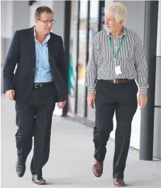  ?? Picture: RICHARD GOSLING ?? Titans chief executive Graham Annesley and boardmembe­r Daryl Kelly after axing Neil Henry yesterday.