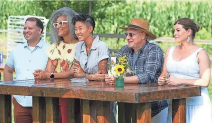  ?? DAVID MOIR PHOTOS/BRAVO ?? Milwaukee chef Dane Baldwin, left, joined guest judge Carla Hall, host Kristen Kish and perennial judges Tom Colicchio and Gail Simmons as they judged the cheese festival dishes on “Top Chef: Wisconsin” Episode 3.