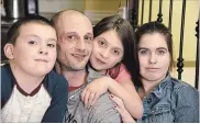  ??  ?? Chris Garner, 38, in a photo from last December with his three children, eight-year-old Brennan, Jaiden, 11 and Kayla, 15.