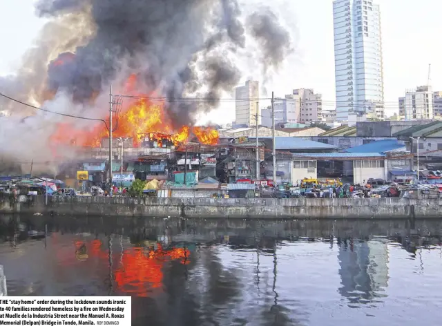  ??  ?? THE “stay home” order during the lockdown sounds ironic to 40 families rendered homeless by a fire on Wednesday at Muelle de la Industria Street near the Manuel A. Roxas Memorial (Delpan) Bridge in Tondo, Manila.