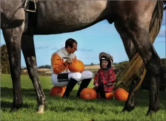  ??  ?? And they’re off!Joined by young Charles Flood (age 2), top Irish amateur jockey Jamie Codd saddles up to launch the Dowth Point-to-Point and Country Fair at Dowth, Brú na Bóinne, County Meath – taking place on Sunday 28th October.