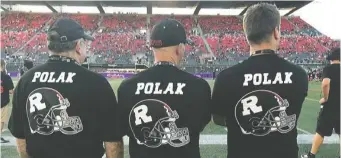  ??  ?? Coaches wear special shirts honouring former Rough Riders GM Jo-Anne Polak.