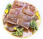  ??  ?? Crispy pork belly kare-kare with macadamia nuts and truffle oil by chef Sau del Rosario