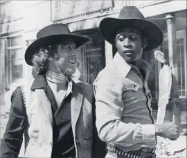  ?? Warner Bros. ?? GENE WILDER, left, played it a bit different in 1974’s “Blazing Saddles” with Cleavon Little, holding audience attention but never having his usual meltdown.