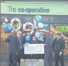  ??  ?? The chairman of Hinckley Sea Cadets unit management trustee Peter Doggett, front left, and Lt/Cdr (SCC) Stewart Woodward, right, receive a cheque for £6,895 from Paul Watson from Earl Shilton Co-op, second from right, and colleagues Robert Laurie from...