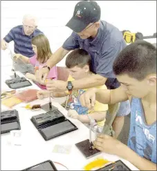  ?? PHOTO SUBMITTED ?? The Clarkson siblings, of Anderson, enjoyed some family time together at the recent Young Outdoorsme­n United Fly-Tying event held in Pineville. Area youth created their own fishing flies and learned how to cast a fly rod.