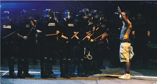  ?? Picture / AP ?? Police and protesters have clashed in Charlotte for three nights running since Keith Lamont Scott was shot dead by police.