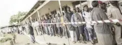  ??  ?? FILE PHOTO: Voters queue at a polling station