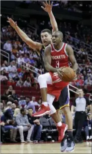  ?? MICHAEL WYKE — THE ASSOCIATED PRESS ?? In this Jan. 20, 2018, file photo, Houston Rockets guard Chris Paul (3) shoots in front of Golden State Warriors guard Klay Thompson (11) during the second half of an NBA basketball game, in Houston.