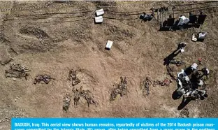  ??  ?? BADUSH, Iraq: This aerial view shows human remains, reportedly of victims of the 2014 Badush prison massacre committed by the Islamic State (IS) group, after being unearthed from a mass grave in the northern Iraqi village of Badush, northwest of the city of Mosul. —AFP