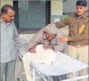  ?? HT PHOTO ?? Father Naresh Bairwa with the victim’s body at the mortuary in Bharatpur on Wednesday.