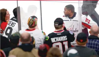  ??  ?? Fans taunt Capitals winger Devante Smith- Pelly on Saturday night at the United Center. Four fans were ejected.