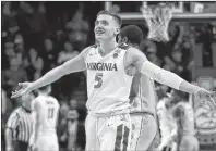  ?? AP PHOTO ?? Virginia guard Kyle Guy (5) celebrates as the final seconds wind off the clock against North Carolina in the championsh­ip game of an NCAA college basketball game during the Atlantic Coast Conference men’s tournament Saturday in New York.