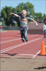  ?? NEWS PHOTO EMMA BENNETT ?? In this June 7, 2017 file photo, Riley Unrau, a Grade 5 student from River Heights School, competes in long jump at the city’s Grade 5 track and field meet at Rotary Track. Rotary Track is getting major renovation­s this summer worth $636,000.