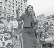  ?? Irfan Khan Los Angeles Times ?? ALEJANDRA VALLES of SEIU addresses supporters of Senate Bill 54 at a rally downtown in March.