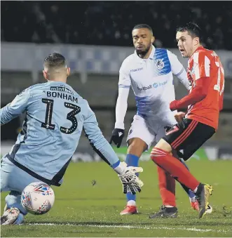  ??  ?? Lewis Morgan scores Sunderland’s second goal at Bristol Rovers on Tuesday night.