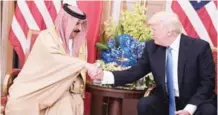  ?? — AFP ?? RIYADH: US President Donald Trump and Bahrain’s King Hamad bin Isa Al-Khalifa take part in a bilateral meeting at a hotel yesterday.
